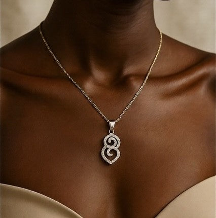 Crystal scroll pendant